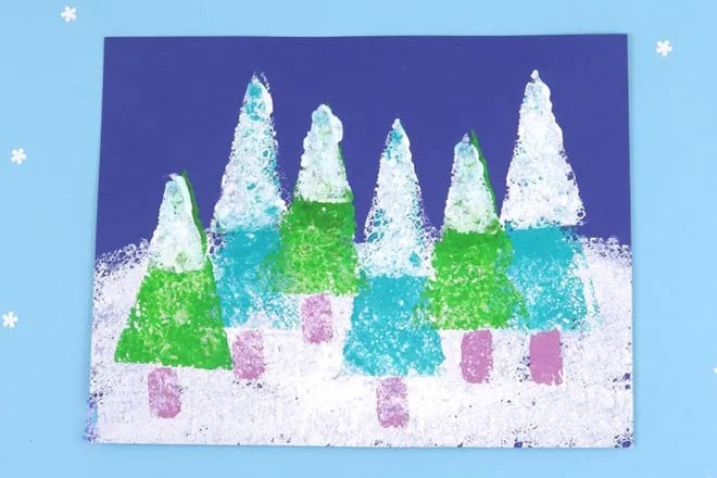 幼兒手工制作：海綿印畫積雪下的冬季大樹